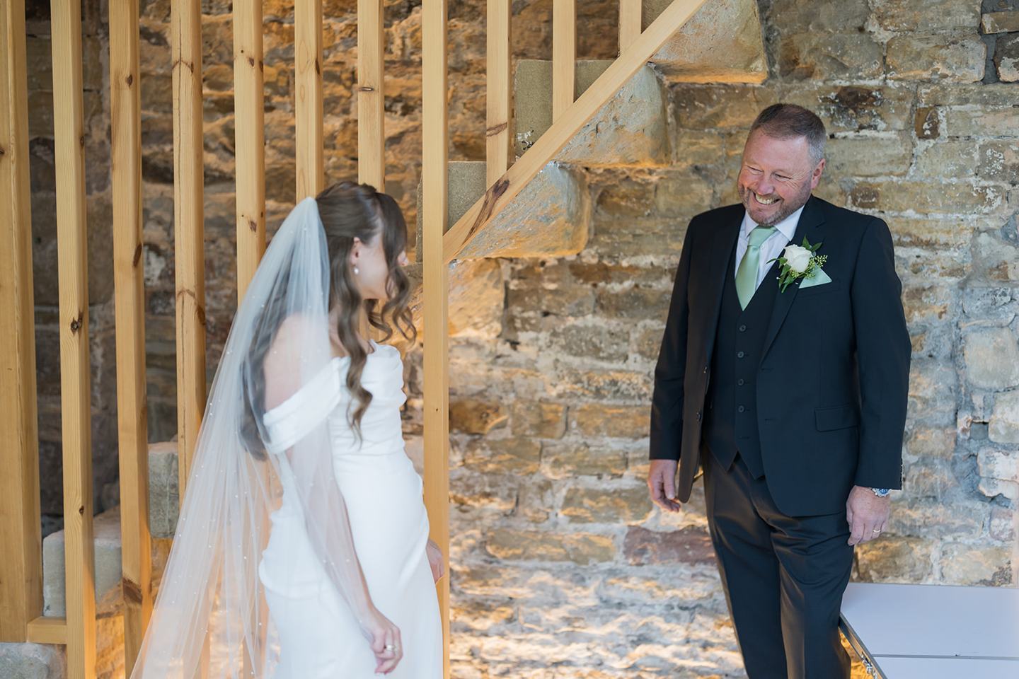 Bride greeting her father at Harriet and Gareth’s Hyde Bank Farm wedding