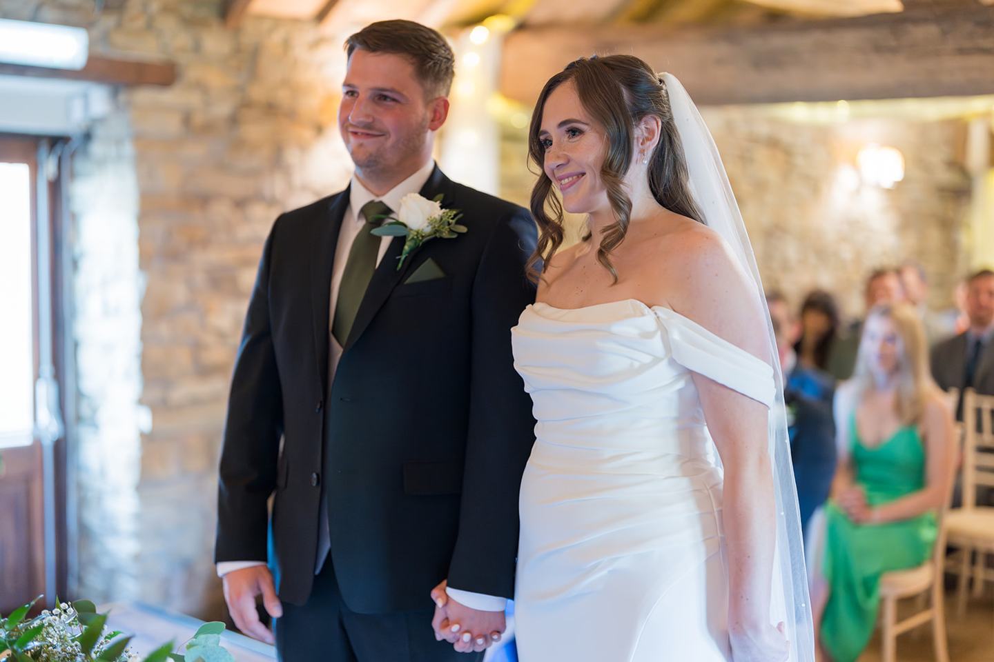 Bride walking down the aisle at Harriet and Gareth’s Hyde Bank Farm wedding