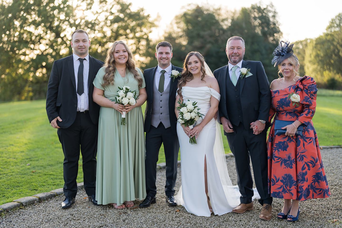 Family photographs in the grounds at Harriet and Gareth’s Hyde Bank Farm wedding