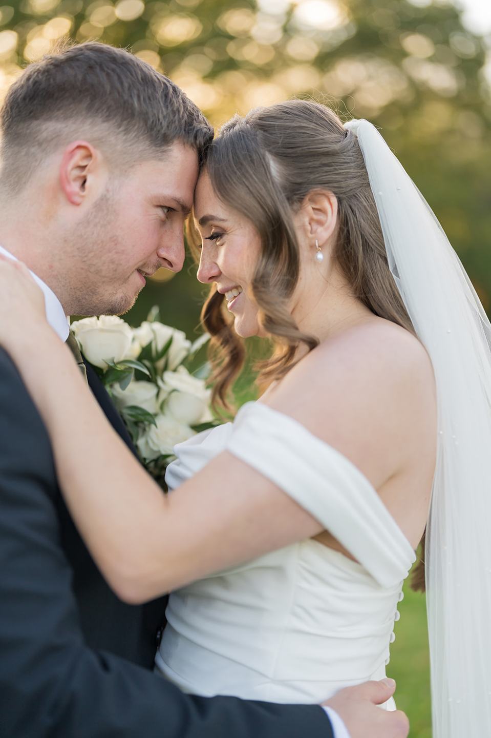 Couple portrait in the autumn light at Harriet and Gareth’s Hyde Bank Farm wedding