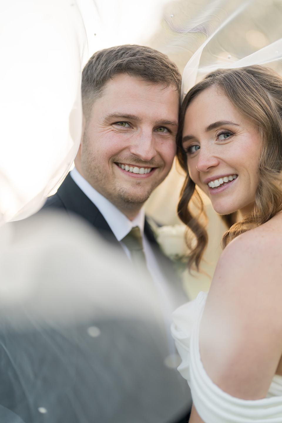Newlyweds beneath the veil at Harriet and Gareth’s Hyde Bank Farm wedding