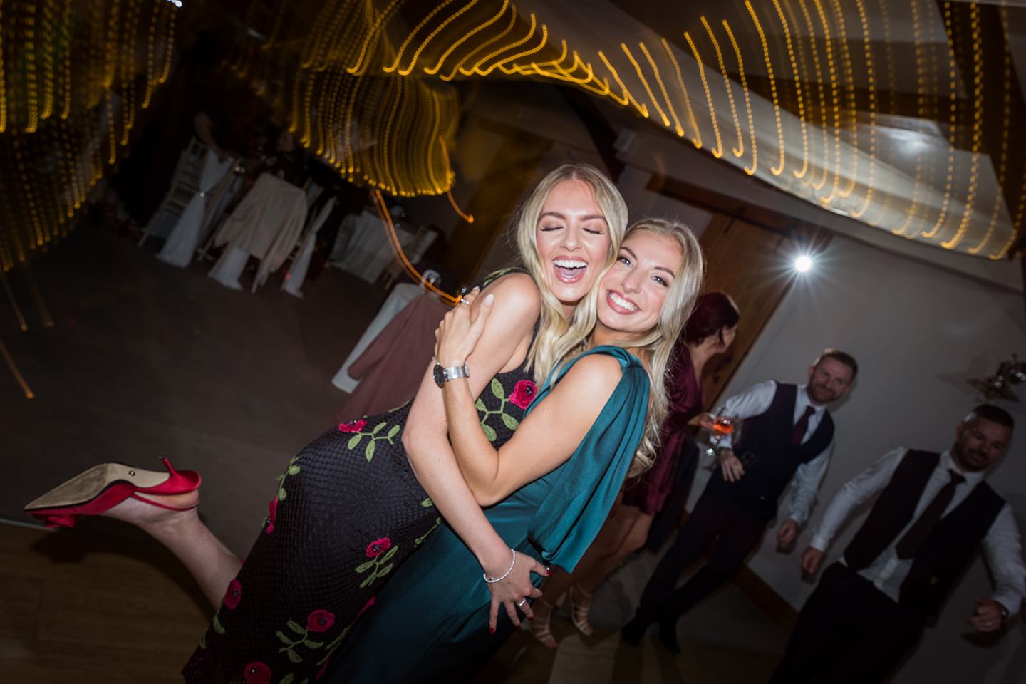 Guests dancing at Harriet and Gareth’s Hyde Bank Farm wedding