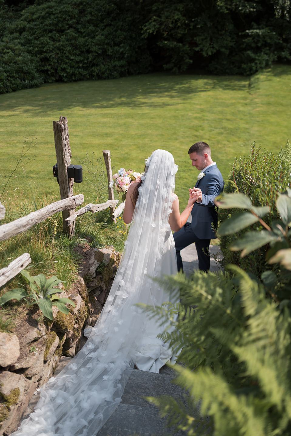 Portrait on the stone bridge at Alex and Dan’s Lancrigg wedding