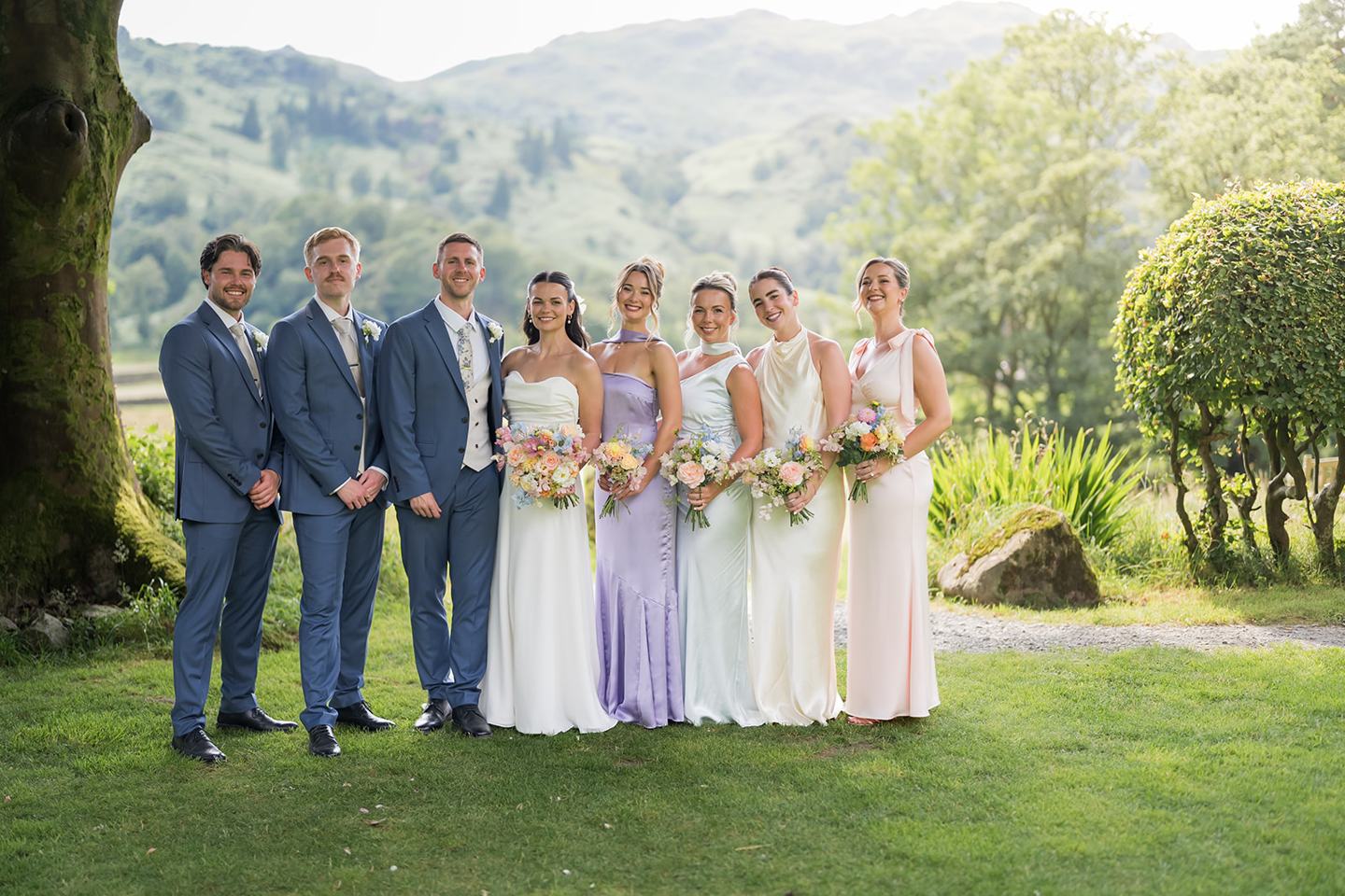 Wedding party with the fells behind at Alex and Dan’s Lancrigg wedding