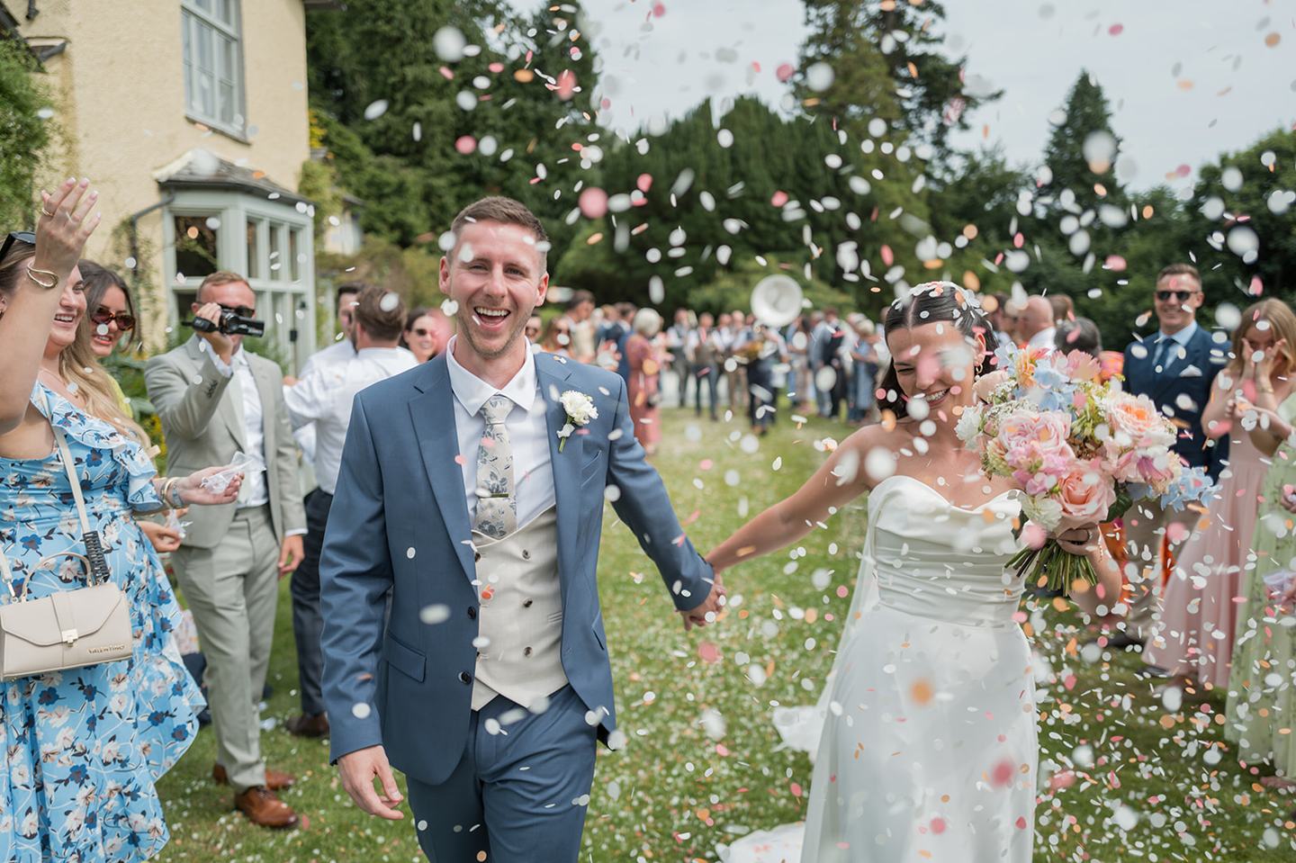 Confetti outside the house at Alex and Dan’s Lancrigg wedding
