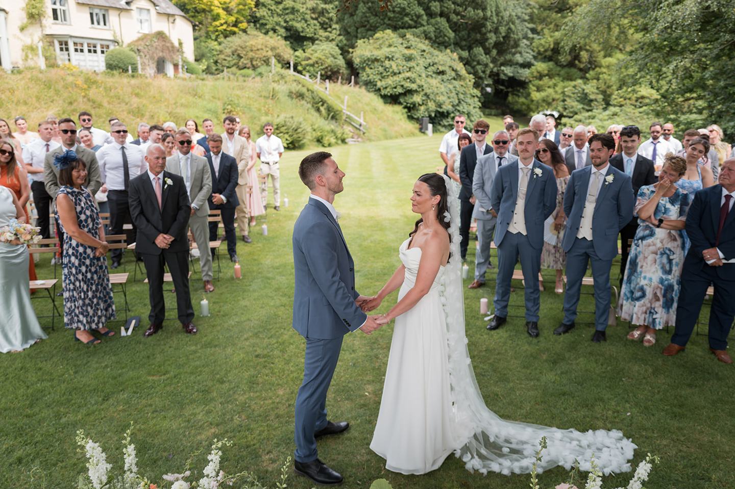 Garden wedding ceremony at Alex and Dan’s Lancrigg wedding