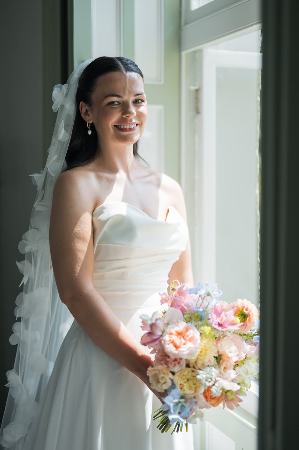 Bridal portrait by the window at Alex and Dan’s Lancrigg wedding