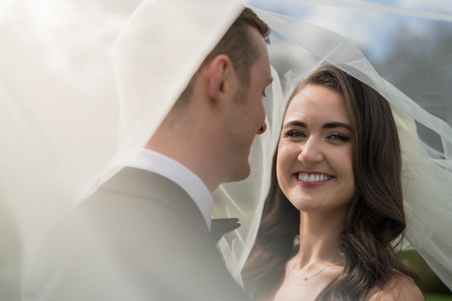 Newlyweds beneath the veil at Becky and Alex’s Middleton Lodge wedding