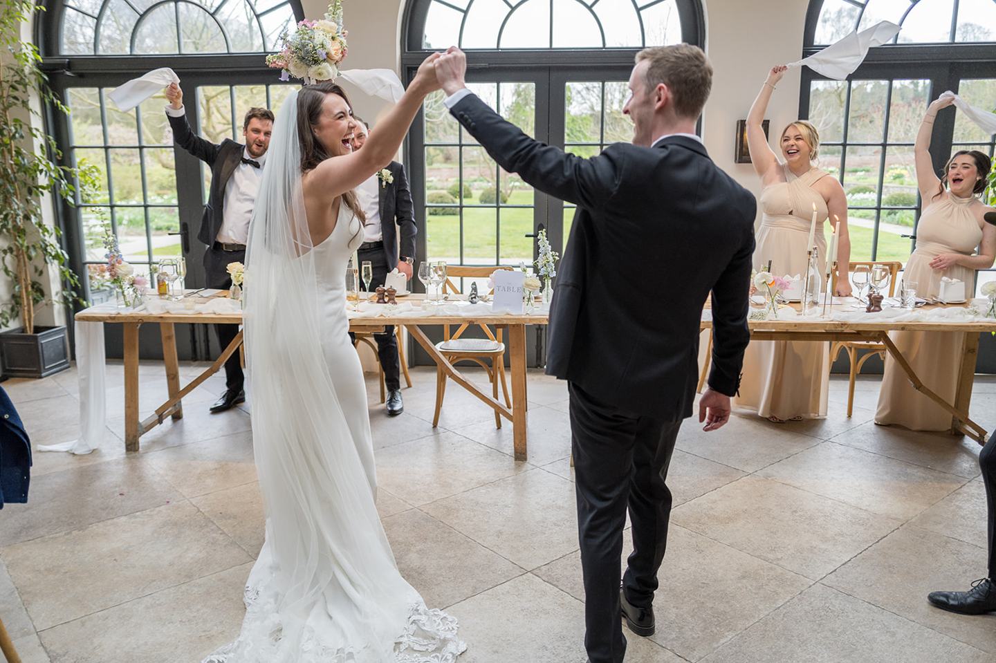 Couple celebrating at their reception at Becky and Alex’s Middleton Lodge wedding