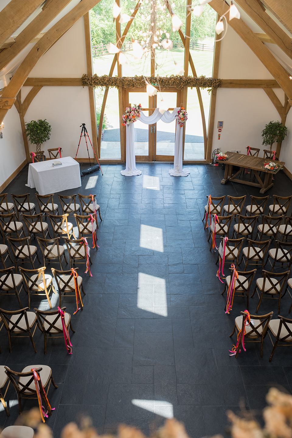 Ceremony room decorated for the wedding at Kate and Kieran’s Mythe Barn wedding