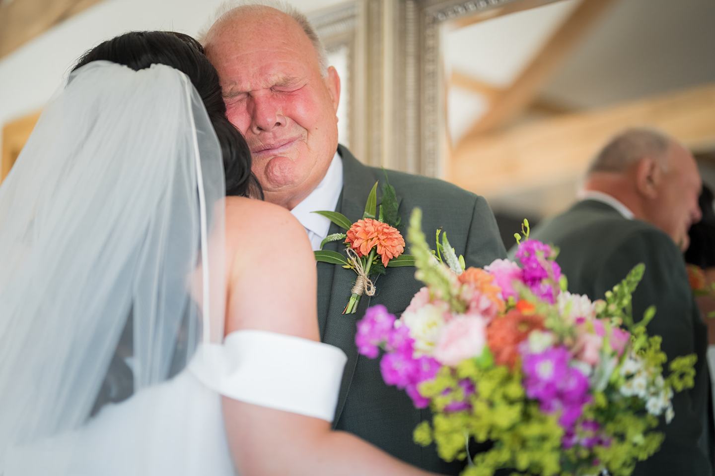 Bride greeting her father at Kate and Kieran’s Mythe Barn wedding