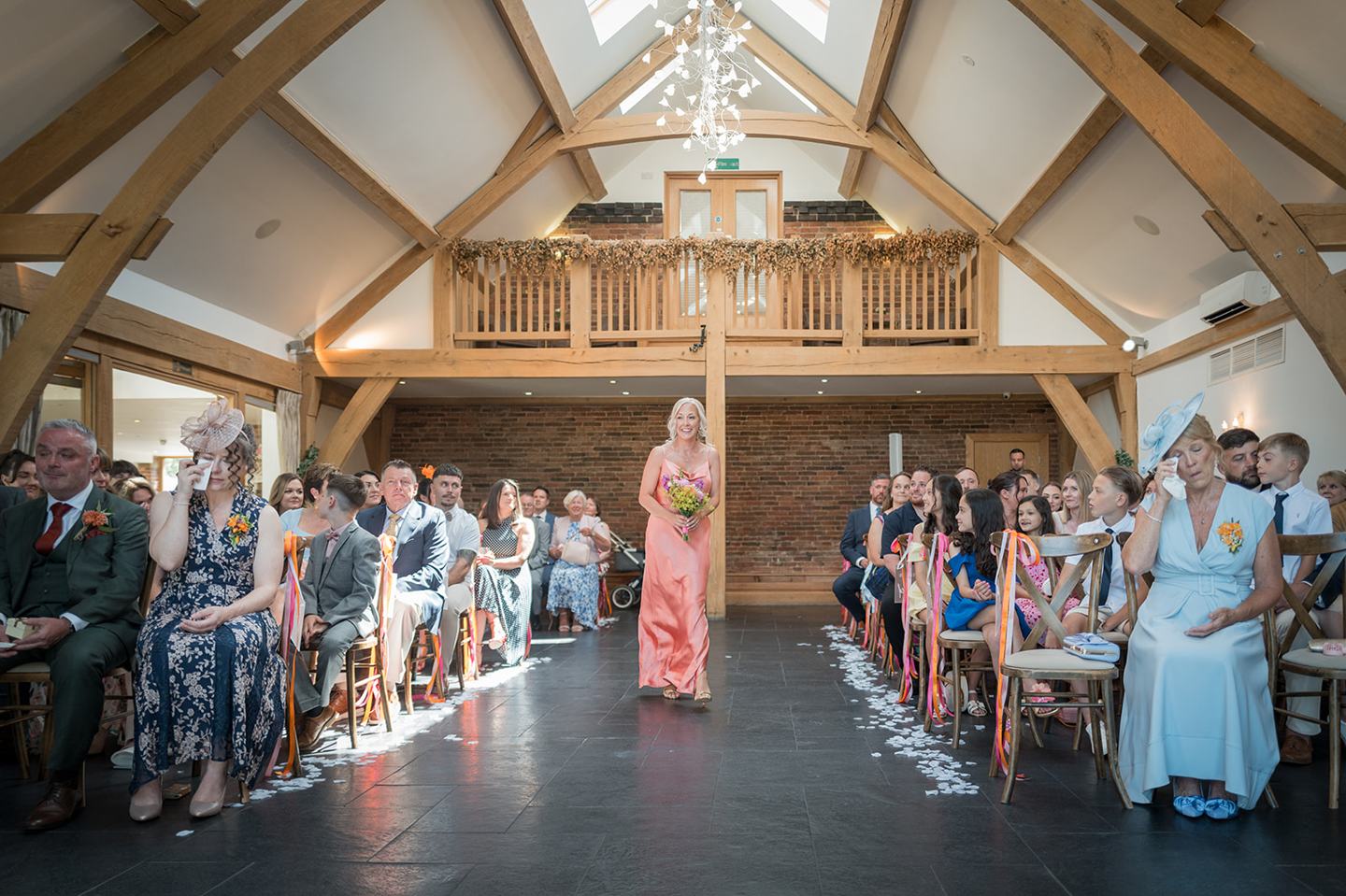 Wedding ceremony in the timber barn at Kate and Kieran’s Mythe Barn wedding
