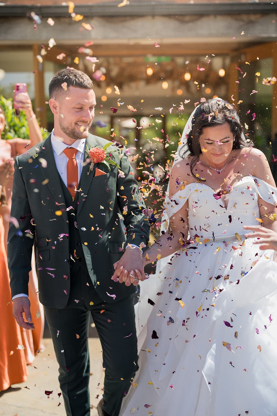 Confetti in the courtyard at Kate and Kieran’s Mythe Barn wedding