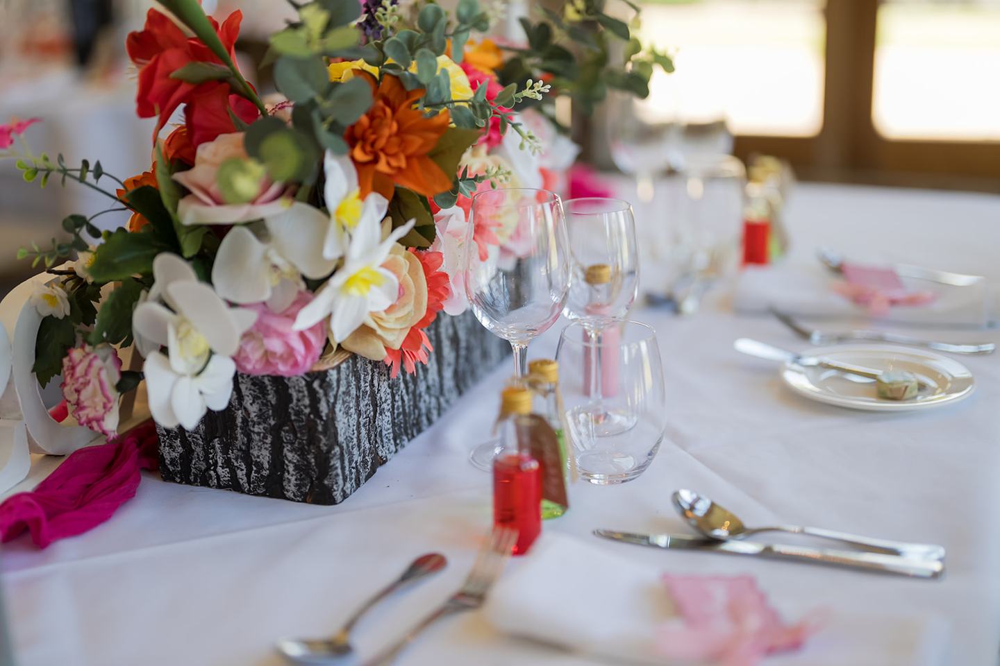 Colourful wedding reception tables at Kate and Kieran’s Mythe Barn wedding