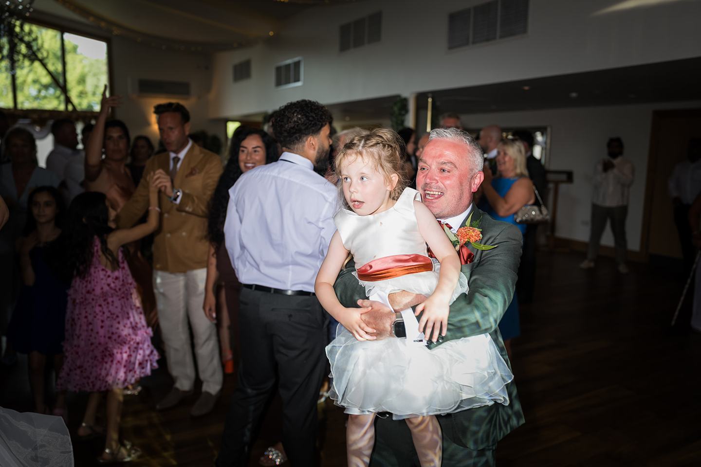 Family celebrating on the dance floor at Kate and Kieran’s Mythe Barn wedding