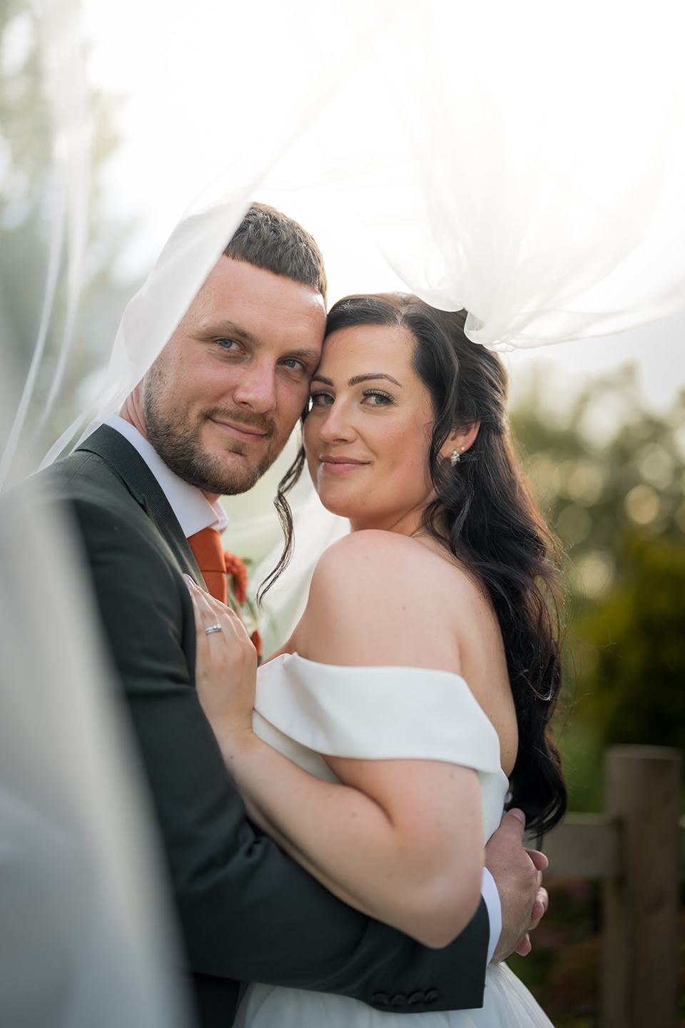Couple beneath the veil at Kate and Kieran’s Mythe Barn wedding