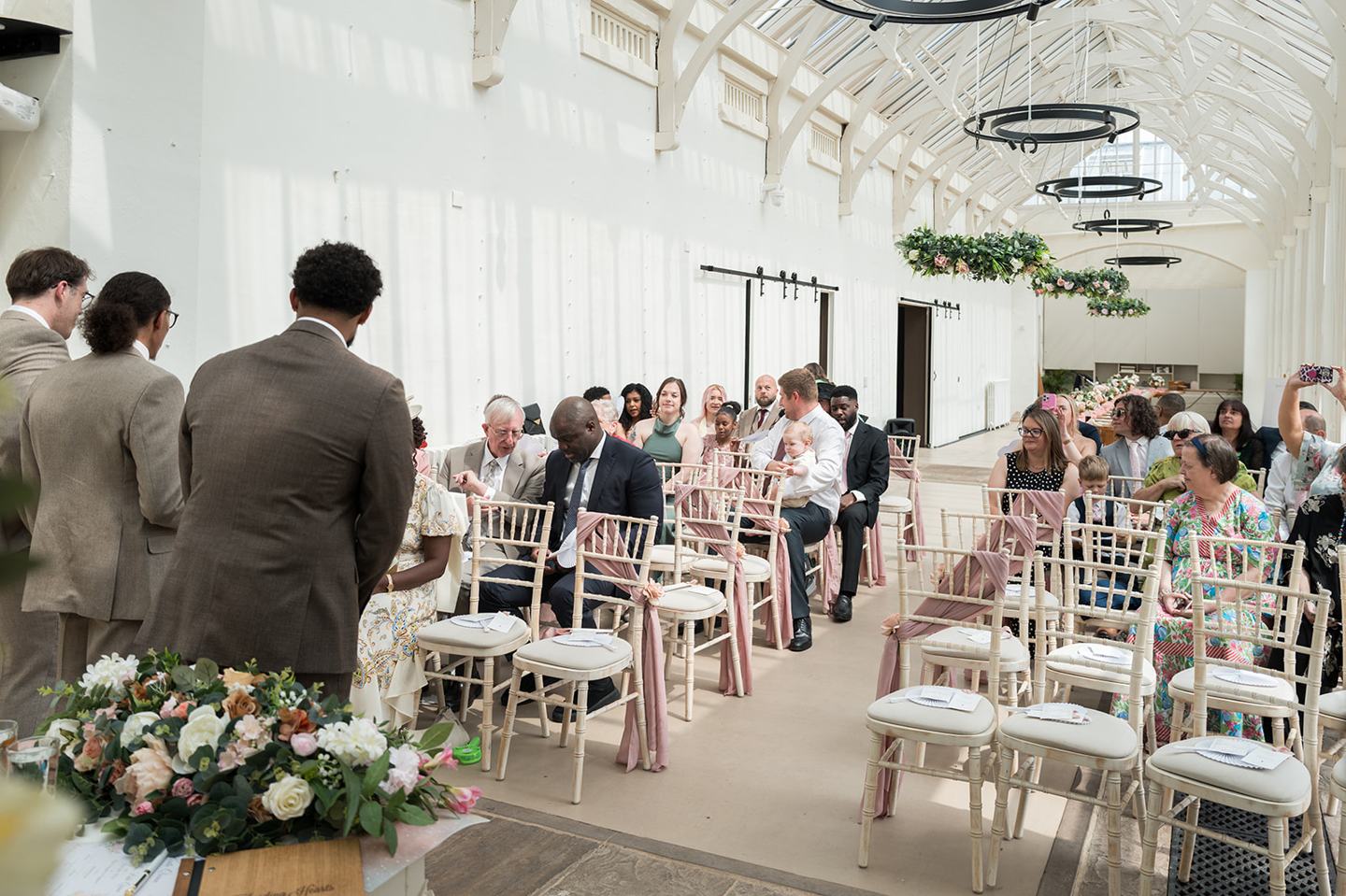 Guests waiting in the Orangery at Kate and Jacob’s The Orangery at Ingestre wedding