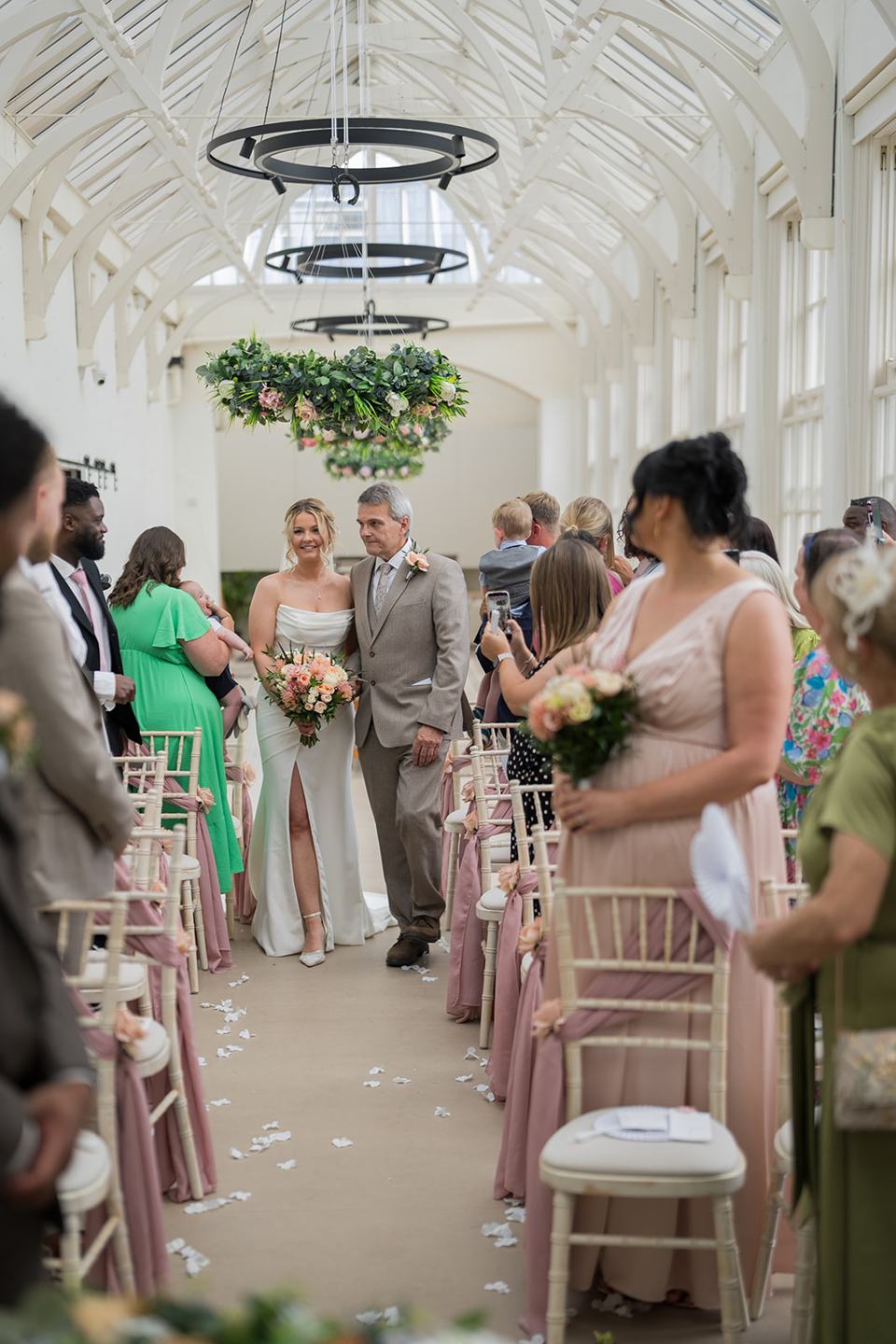 Bride walking down the aisle at Kate and Jacob’s The Orangery at Ingestre wedding