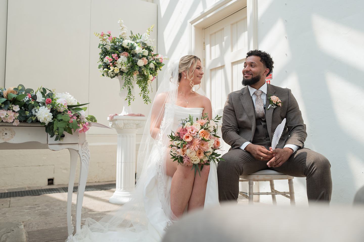 Couple during the ceremony at Kate and Jacob’s The Orangery at Ingestre wedding