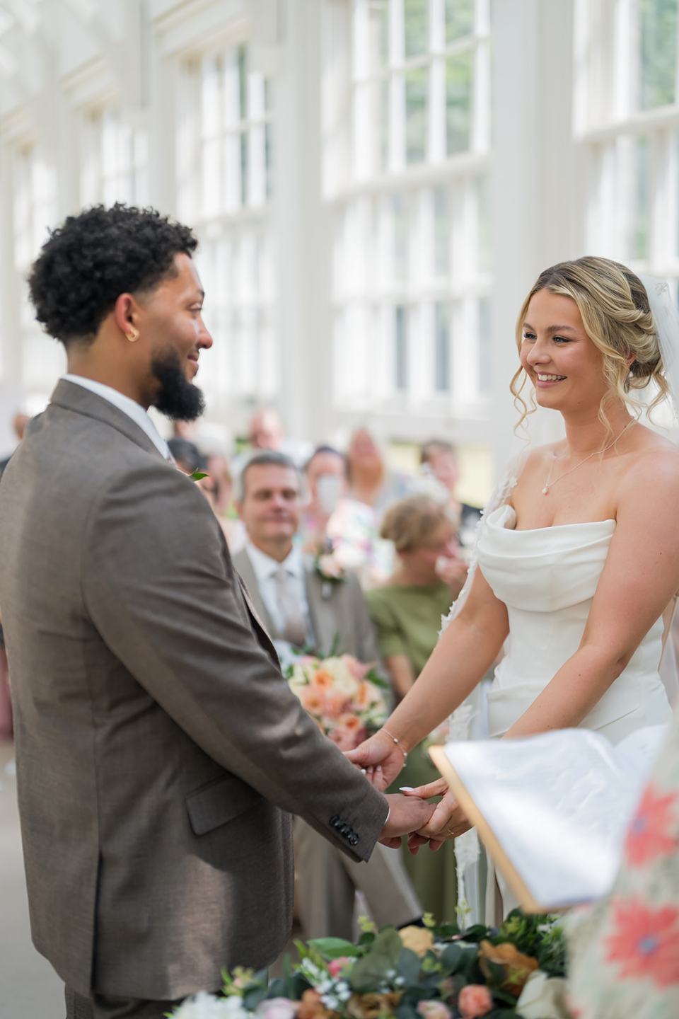 Exchanging wedding vows at Kate and Jacob’s The Orangery at Ingestre wedding