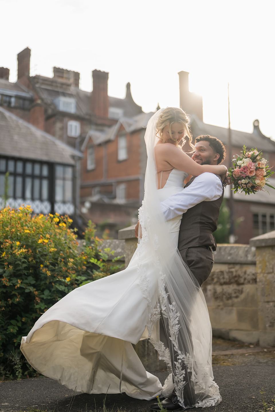 Couple dancing in the gardens at Kate and Jacob’s The Orangery at Ingestre wedding