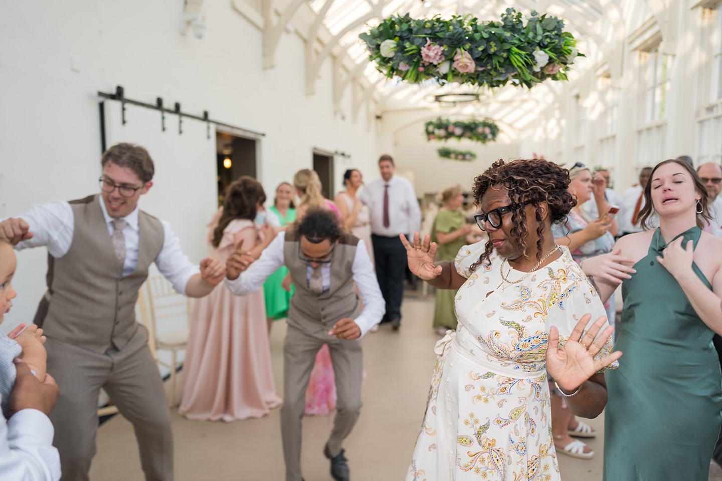 Guests celebrating with the couple at Kate and Jacob’s The Orangery at Ingestre wedding