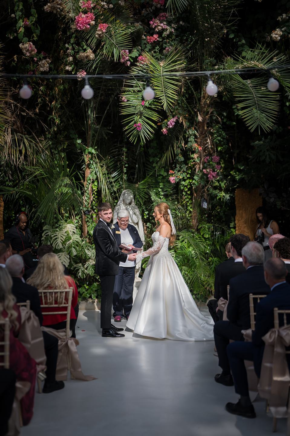 Walking through the Palm House at Heather and Charlie’s Sefton Park Palm House wedding