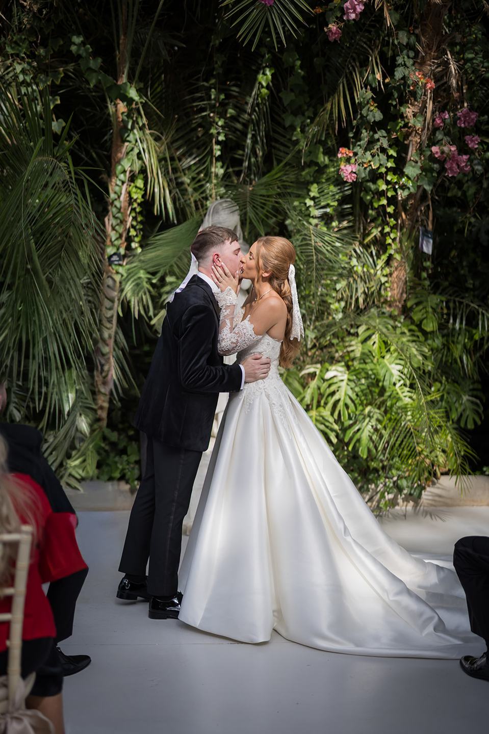 The first kiss at Heather and Charlie’s Sefton Park Palm House wedding