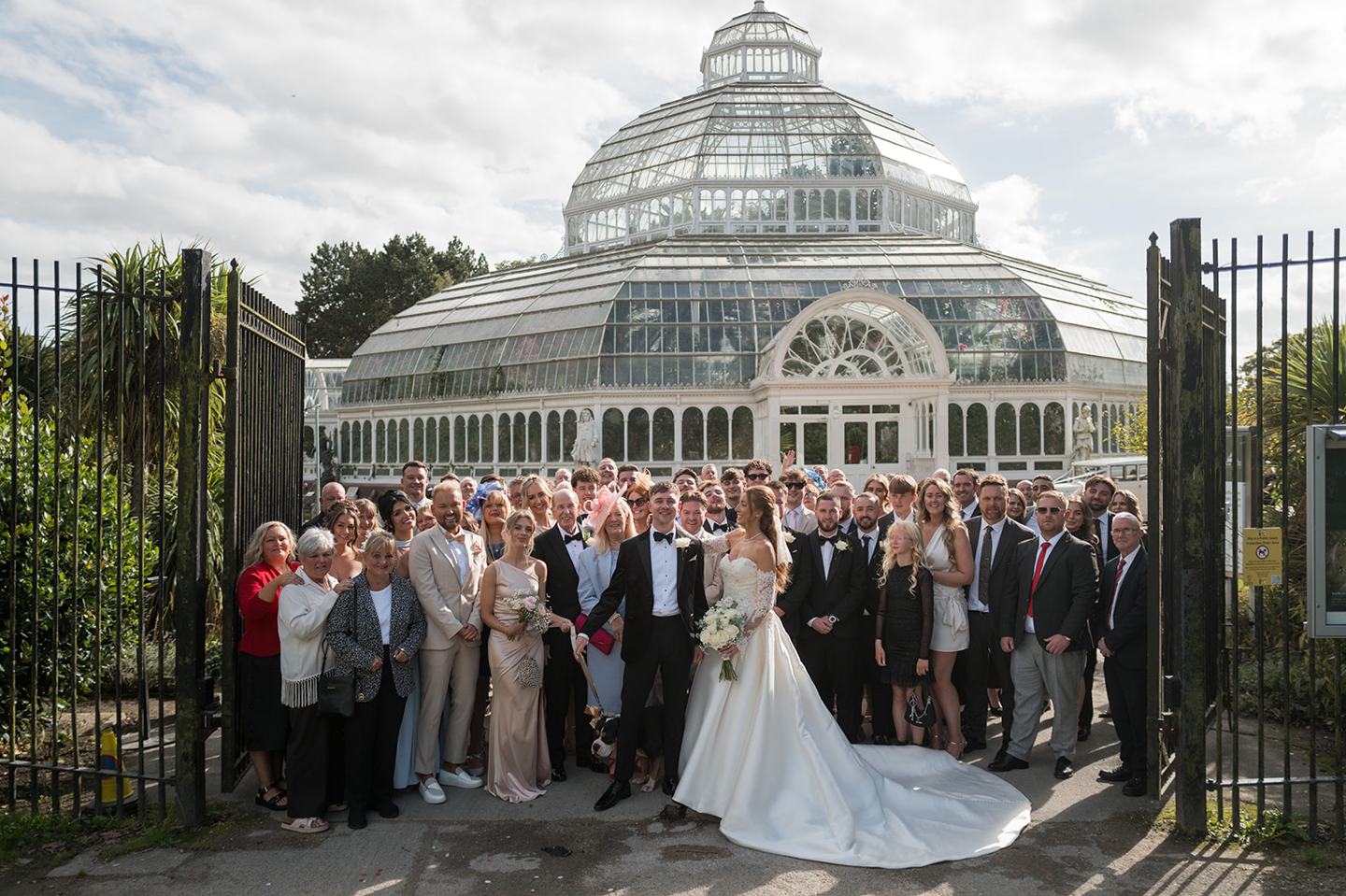 Guests gathered outside at Heather and Charlie’s Sefton Park Palm House wedding