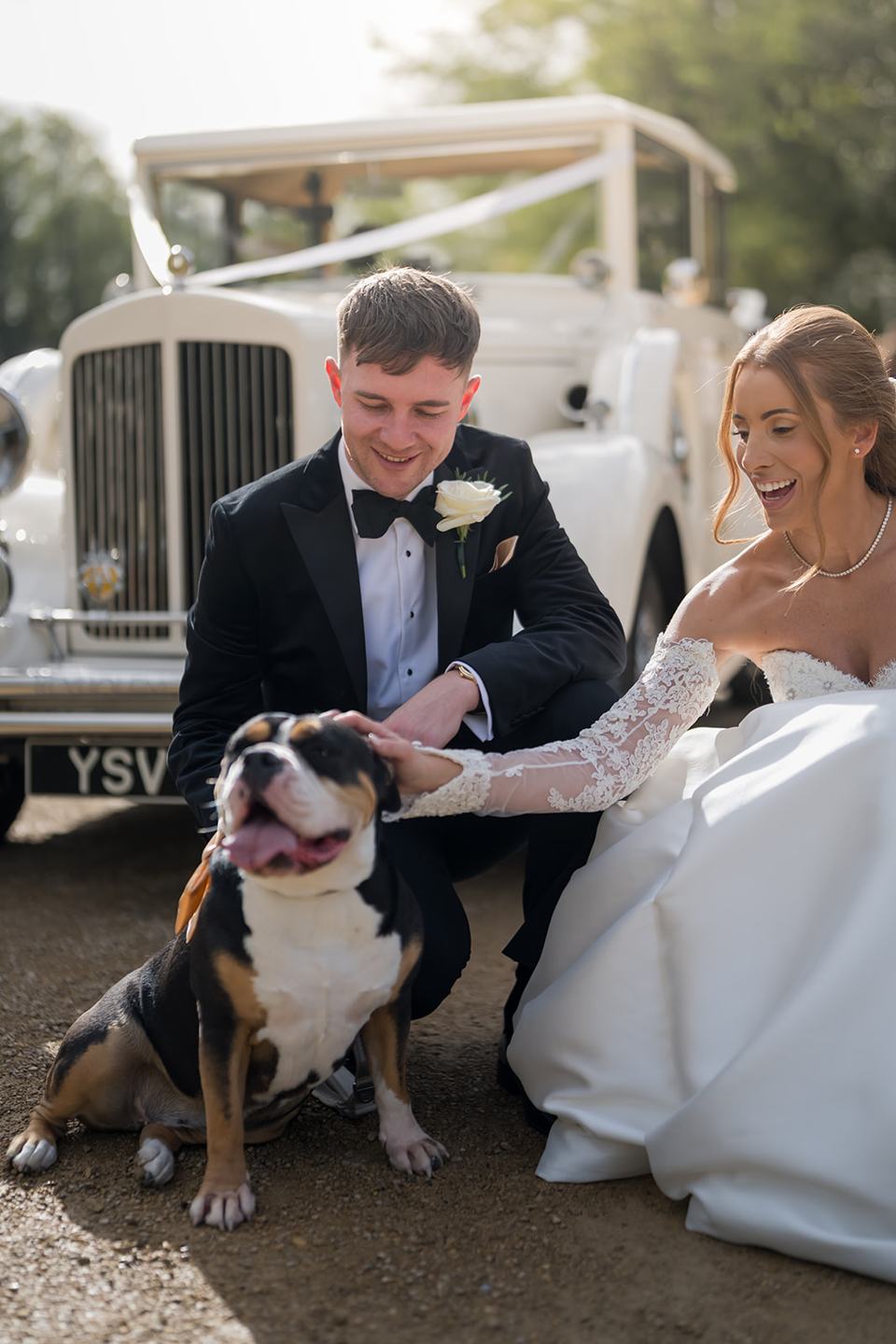 Newlyweds with their dog at Heather and Charlie’s Sefton Park Palm House wedding