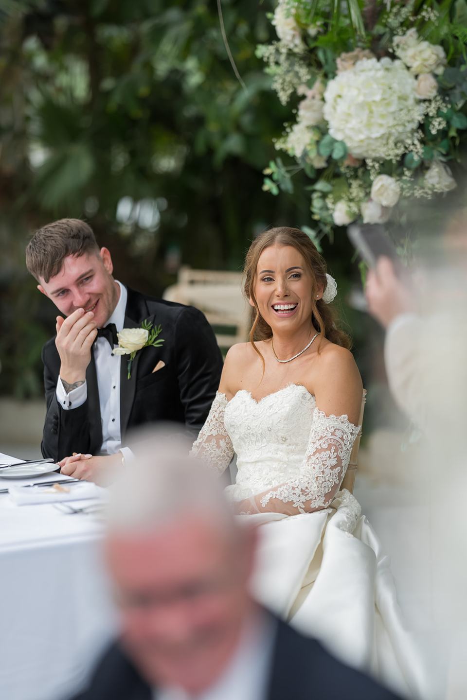 Laughter at the wedding breakfast at Heather and Charlie’s Sefton Park Palm House wedding