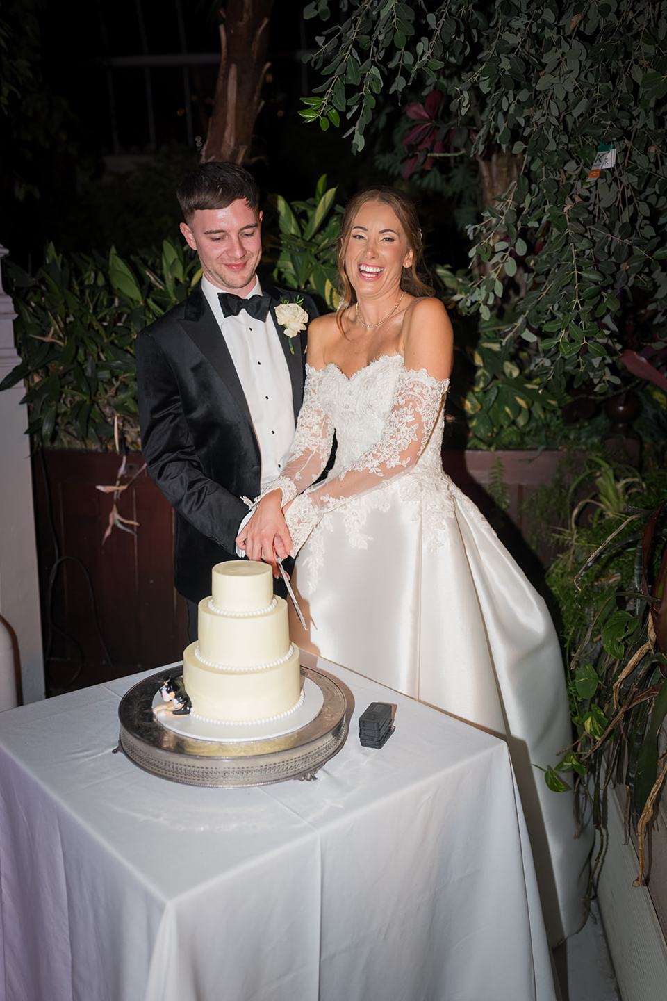 Cutting the cake at Heather and Charlie’s Sefton Park Palm House wedding