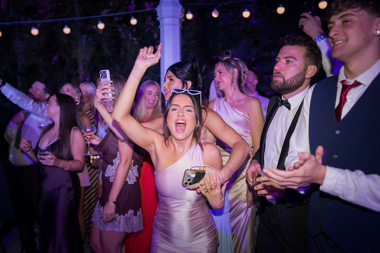 Friends on the dance floor at Heather and Charlie’s Sefton Park Palm House wedding