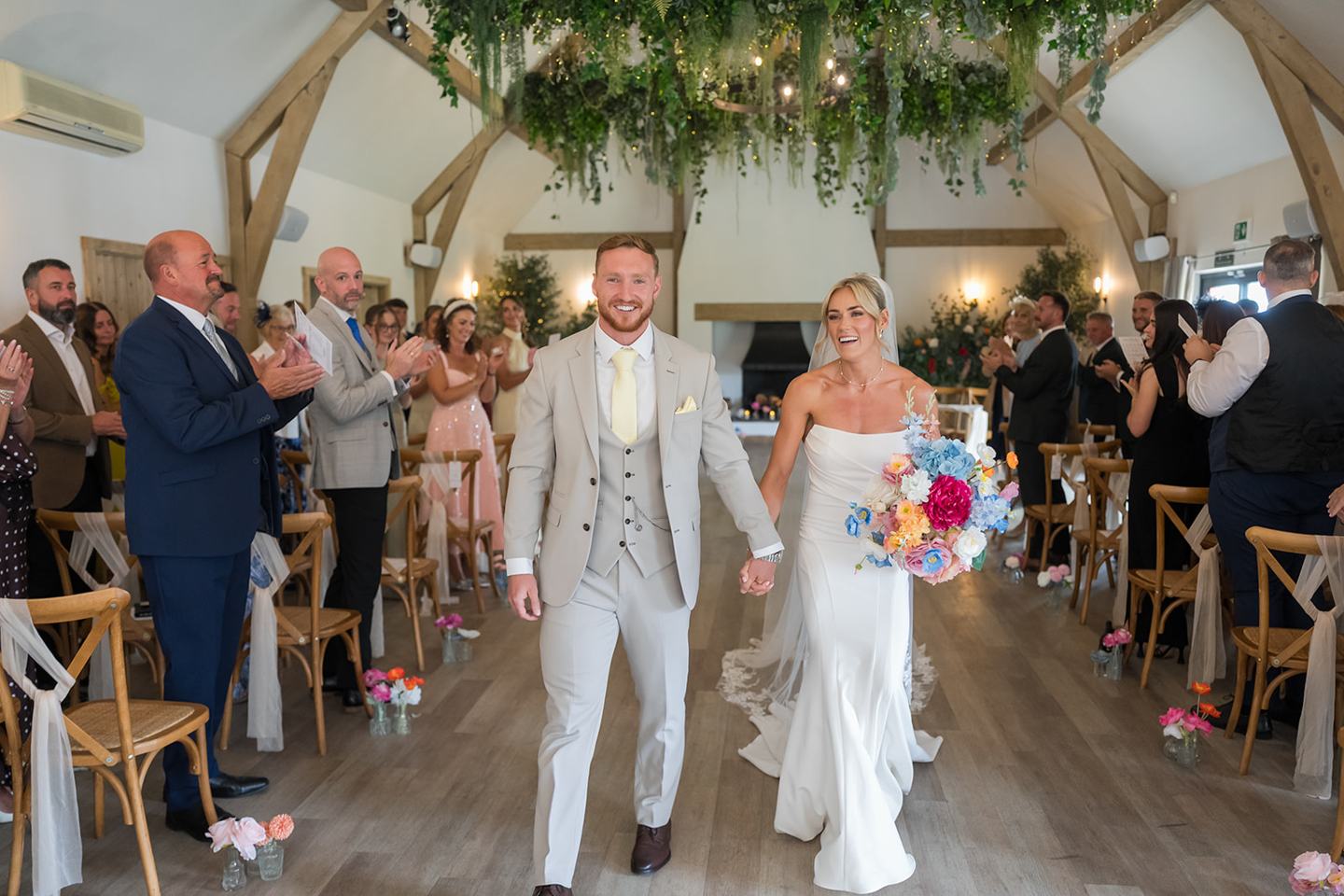 Walking out together at Lauren and Ryan’s The River Barn wedding