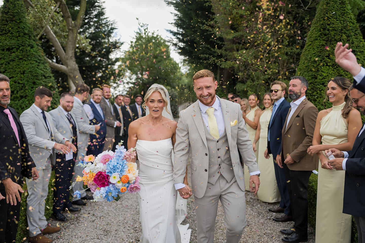 Confetti on the garden path at Lauren and Ryan’s The River Barn wedding