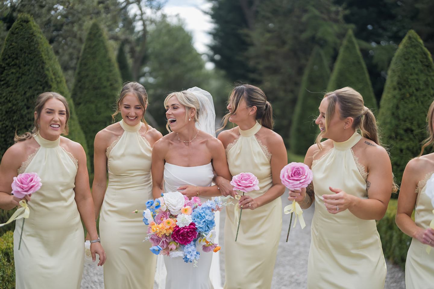 Bridesmaids in the gardens at Lauren and Ryan’s The River Barn wedding
