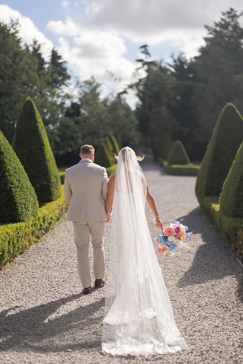 Walking through the grounds at Lauren and Ryan’s The River Barn wedding