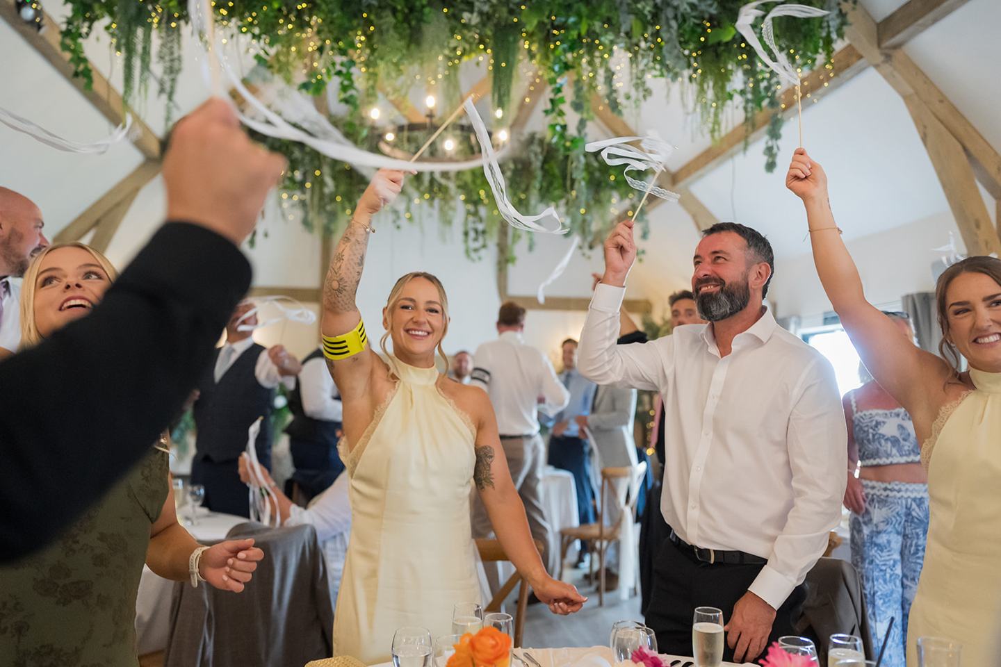 Guests welcoming the newlyweds at Lauren and Ryan’s The River Barn wedding