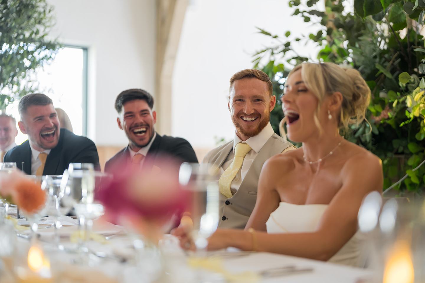 Laughter during speeches at Lauren and Ryan’s The River Barn wedding