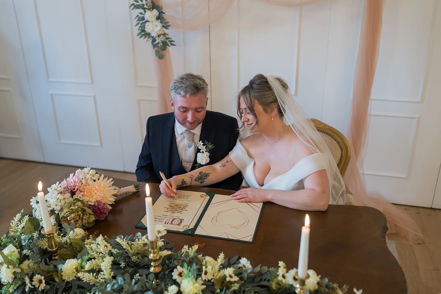 Signing the register at Rachel and Sean’s West Tower wedding