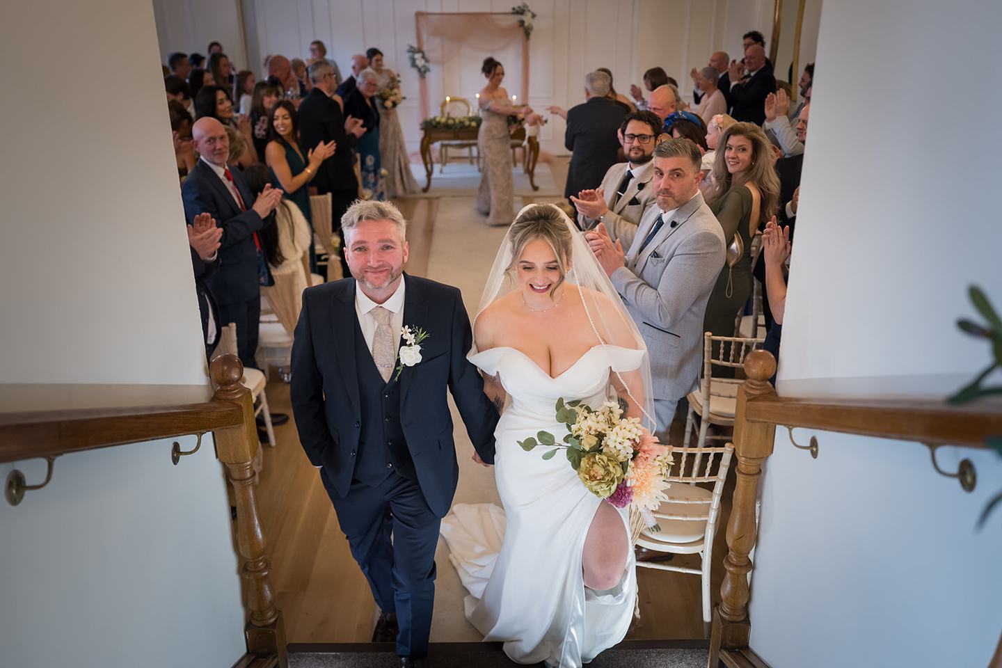 Newlyweds walking out at Rachel and Sean’s West Tower wedding