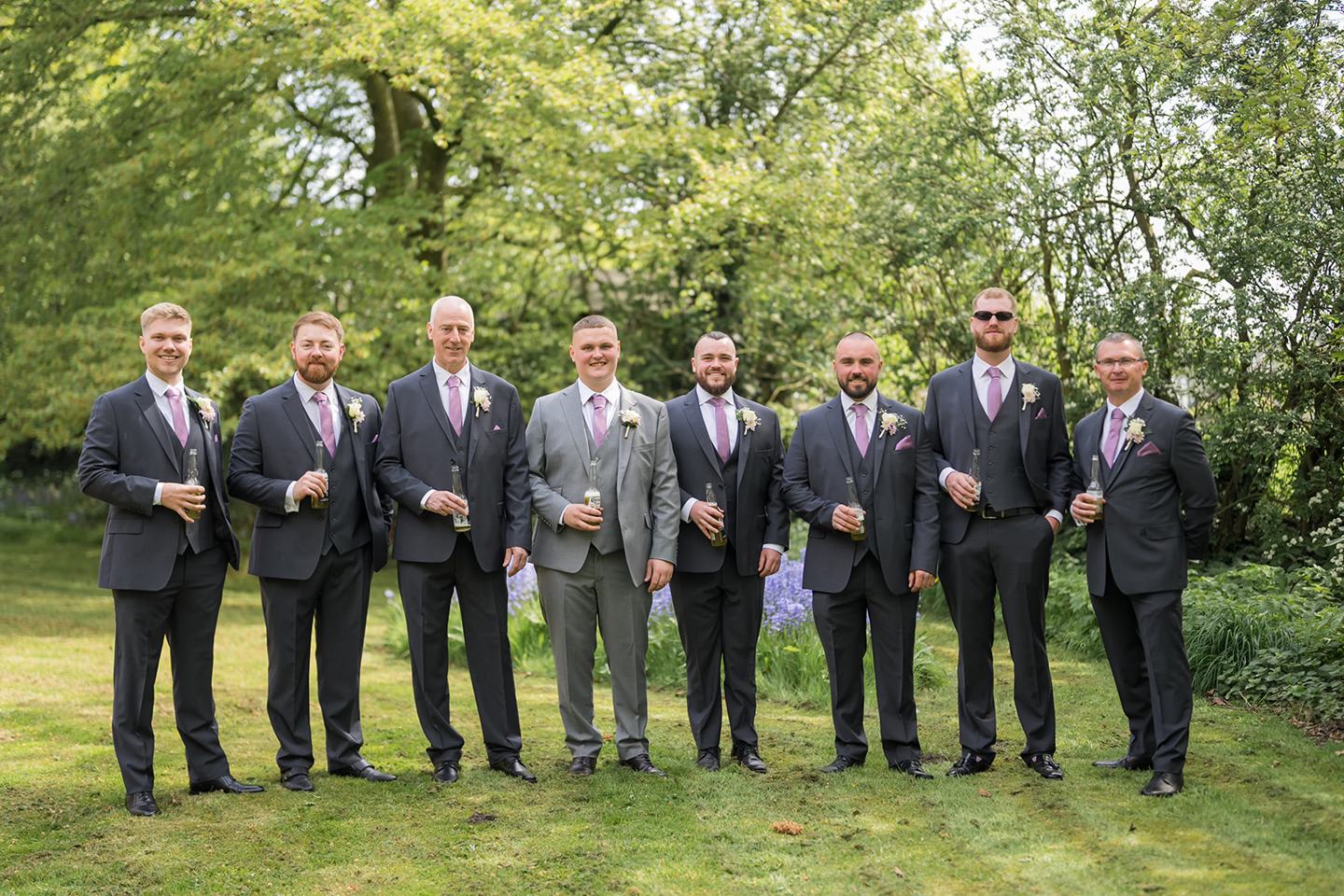 Groom and wedding party in the gardens at Samantha and Adam’s West Tower wedding