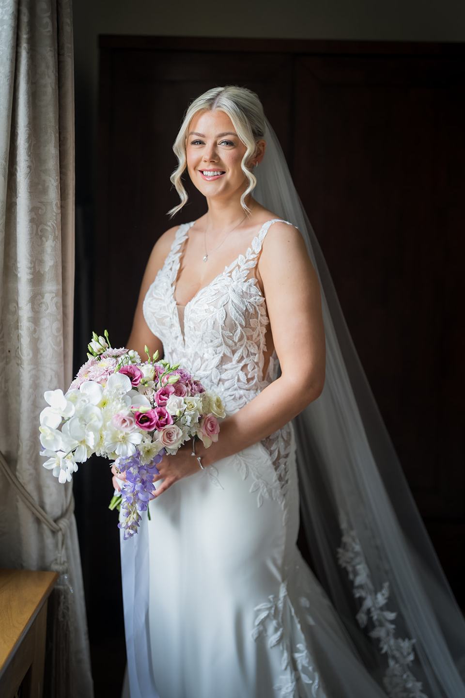 Bridal portrait by the window at Samantha and Adam’s West Tower wedding