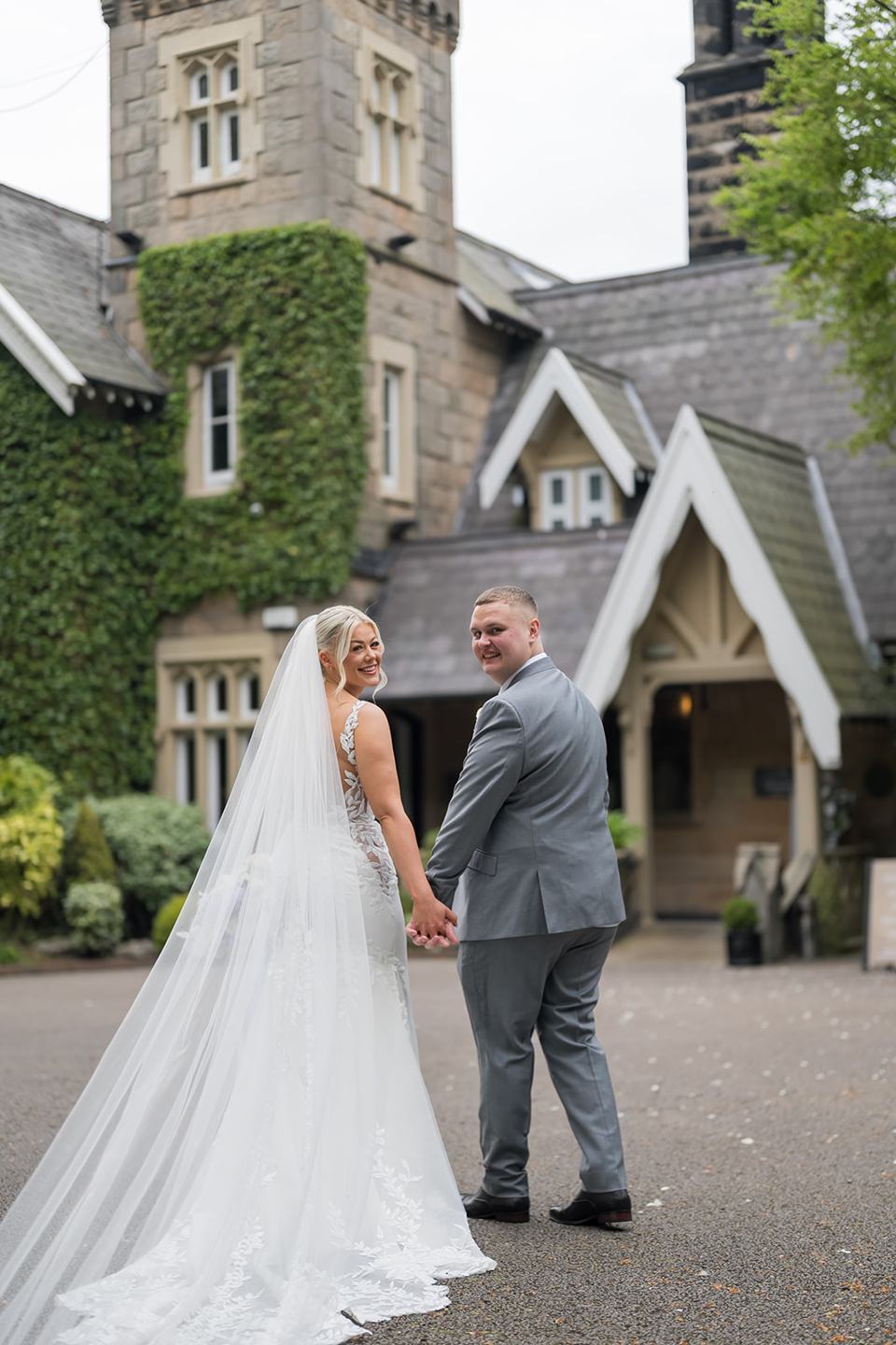 Couple beneath the tower at Samantha and Adam’s West Tower wedding