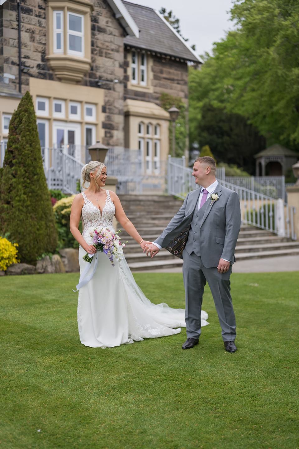 Newlyweds in the gardens at Samantha and Adam’s West Tower wedding