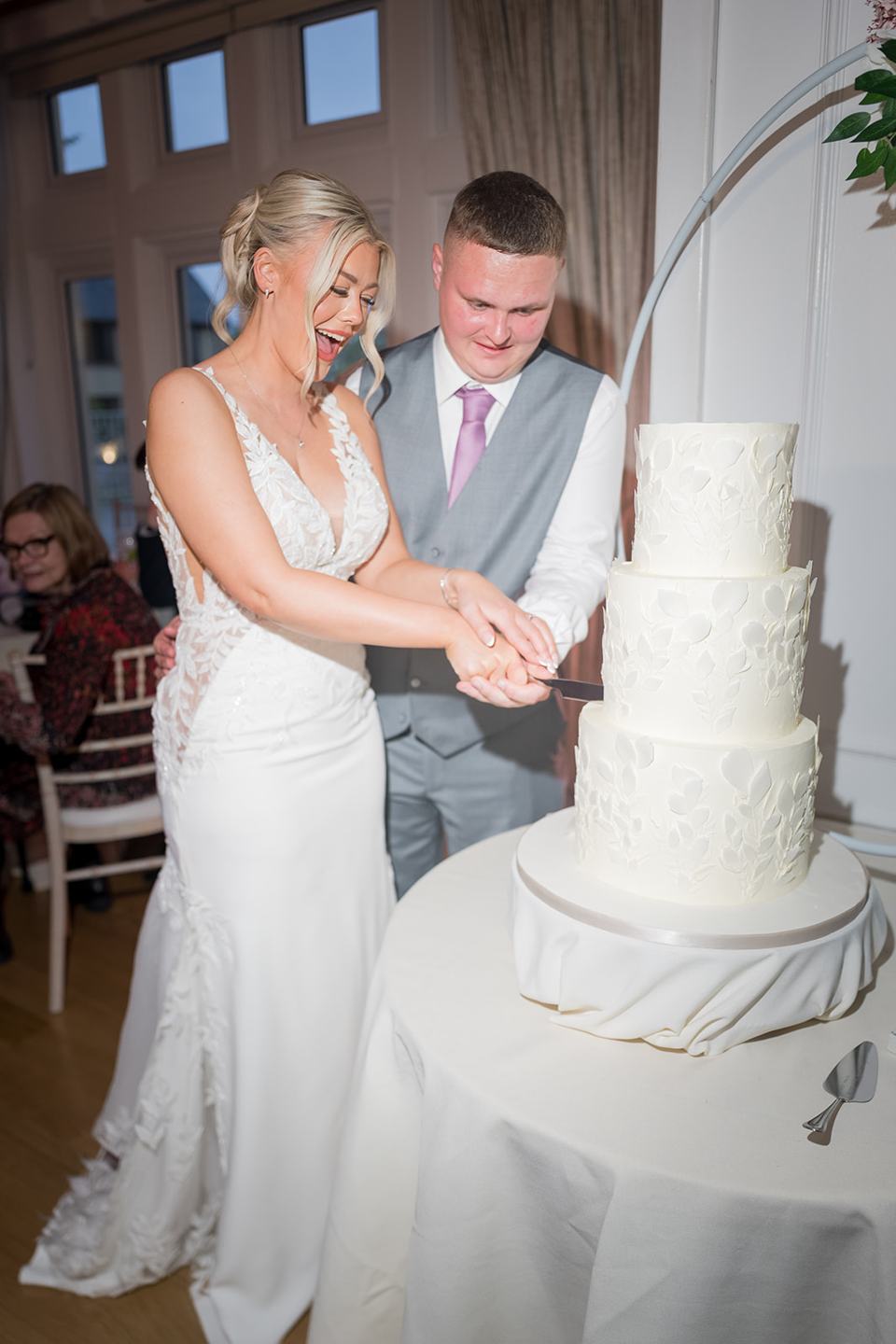 Cutting the cake at Samantha and Adam’s West Tower wedding