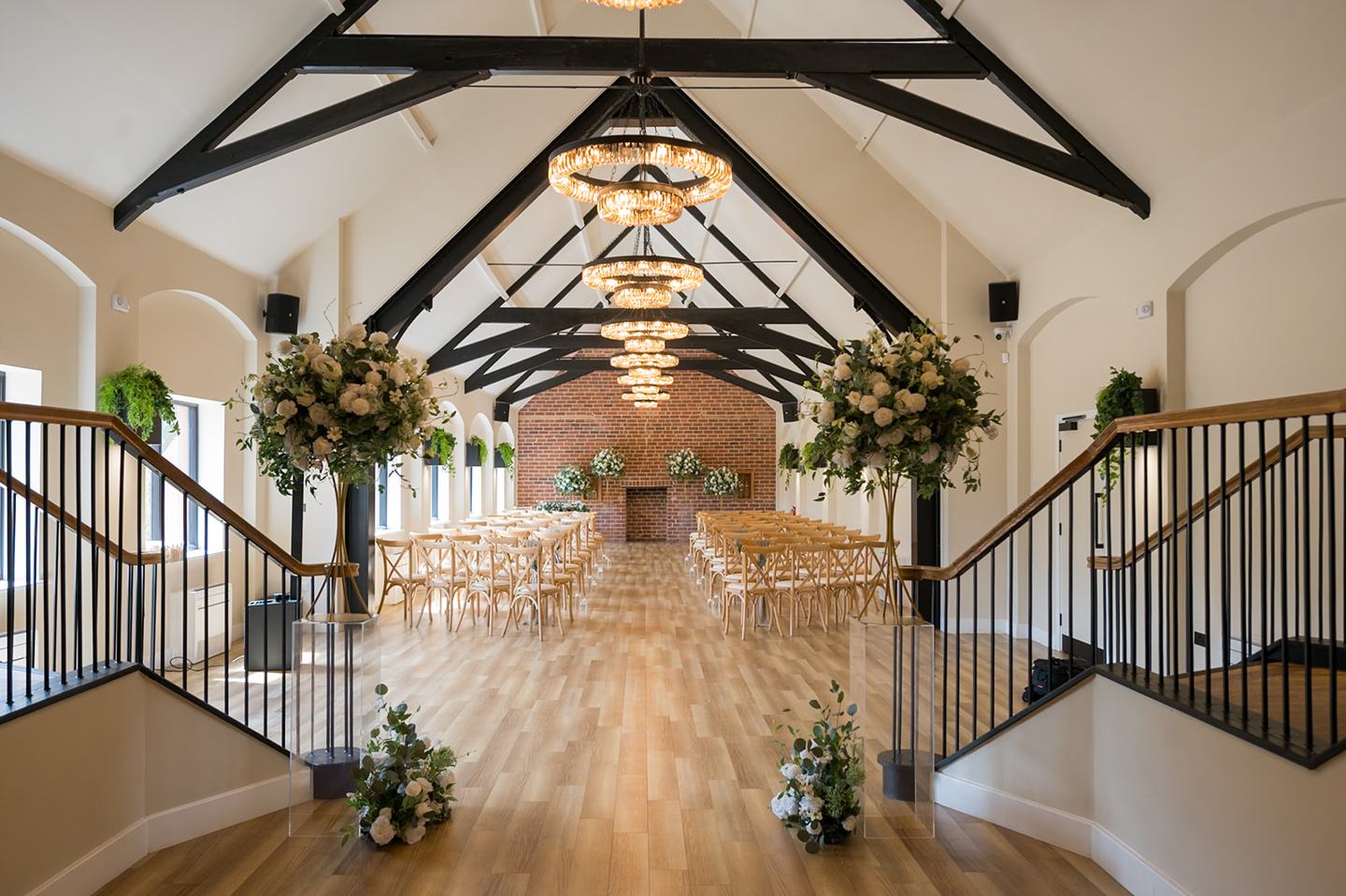 Ceremony room dressed with flowers at Danielle and Joe’s The Whistle Barns wedding