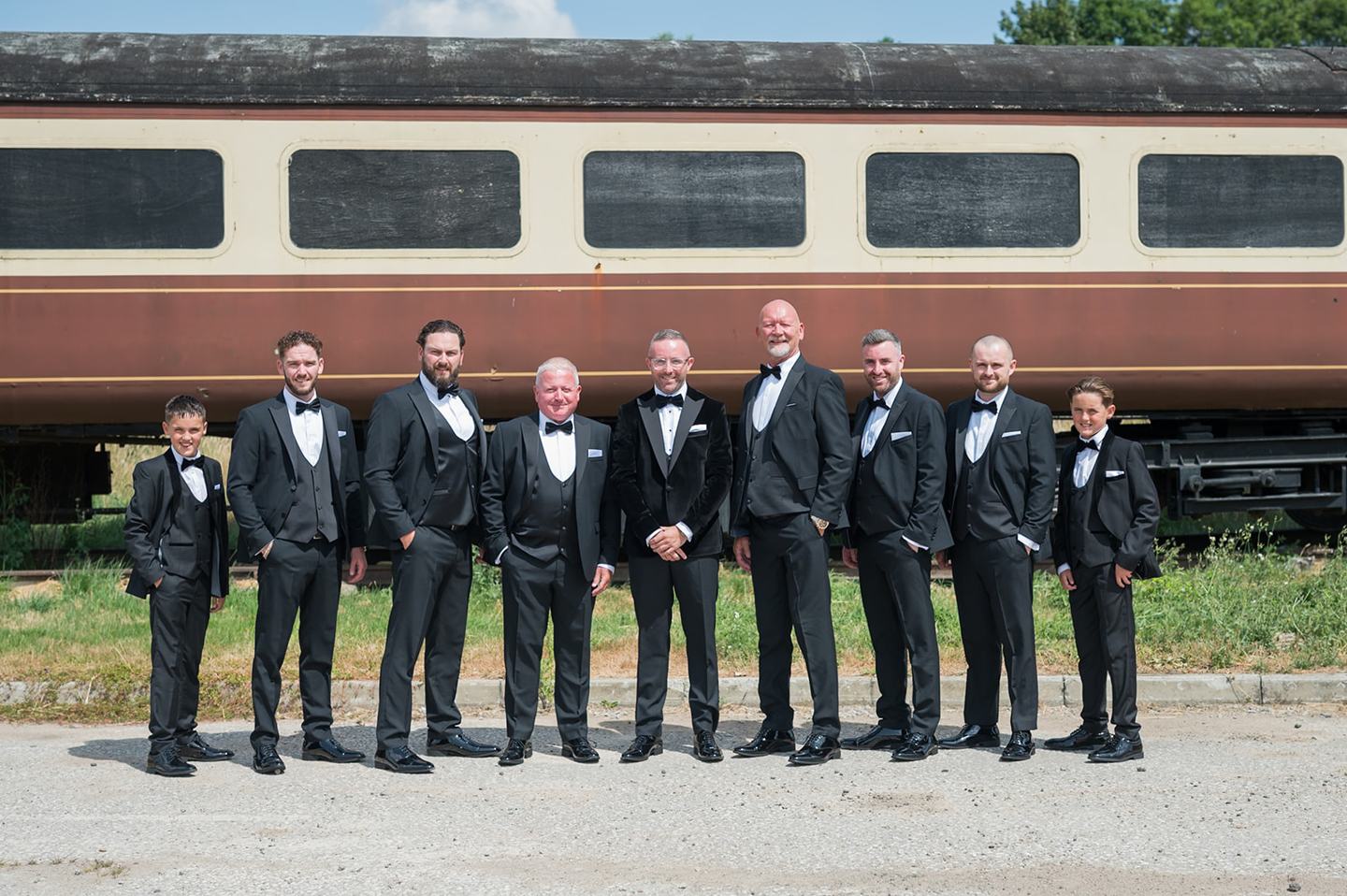 Groomsmen outside the barn at Danielle and Joe’s The Whistle Barns wedding