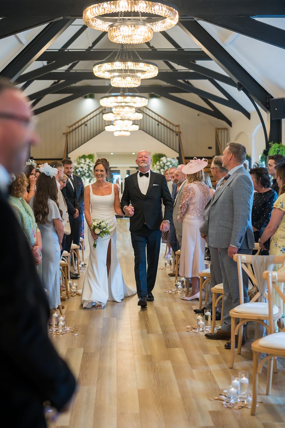 Walking down the aisle at Danielle and Joe’s The Whistle Barns wedding