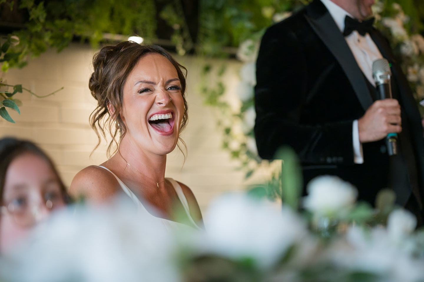 Laughter during the reception at Danielle and Joe’s The Whistle Barns wedding